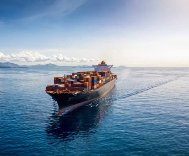 a large cargo ship with containers on the water